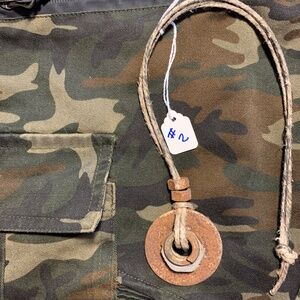 Post apocalyptic industrial hardware necklace on a distressed hemp cord